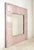 This one of kind wall mirror was made using antique 100 year old tin ceiling tiles painted a pale metallic pink. This...