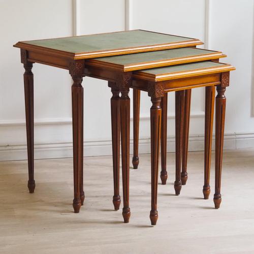 This three-piece nesting table set is stylistically related to late historicism. The graduated proportions, the slender...