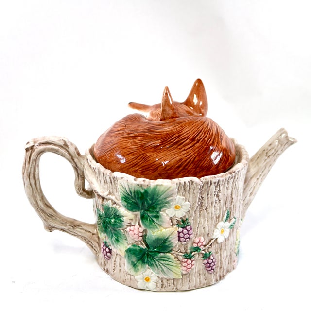 This vintage Fitz and Floyd ceramic majolica faux bois relief teapot, titled "Reynard the Fox," features a charming...