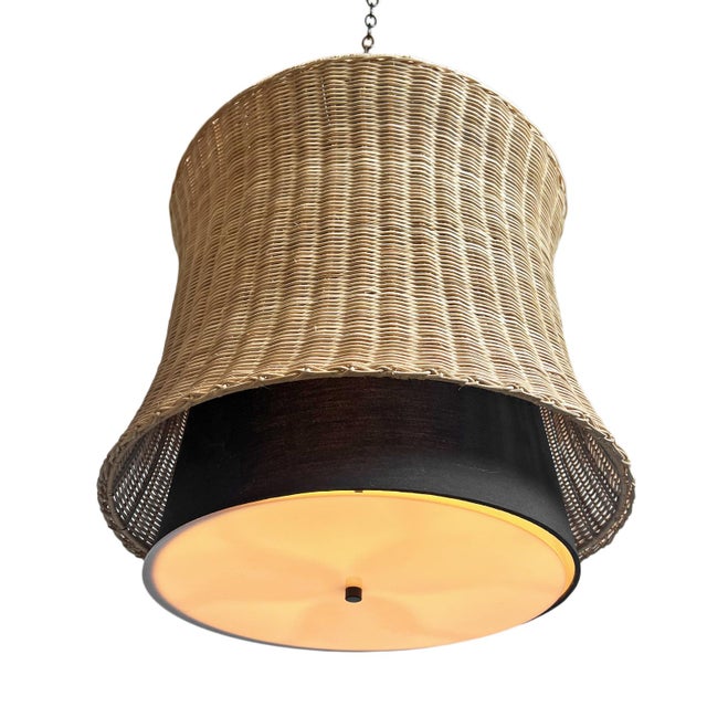 Woven natural wicker pendant lantern with black fabric shade inside. Modern design and shape. Requires three E12 bulbs.