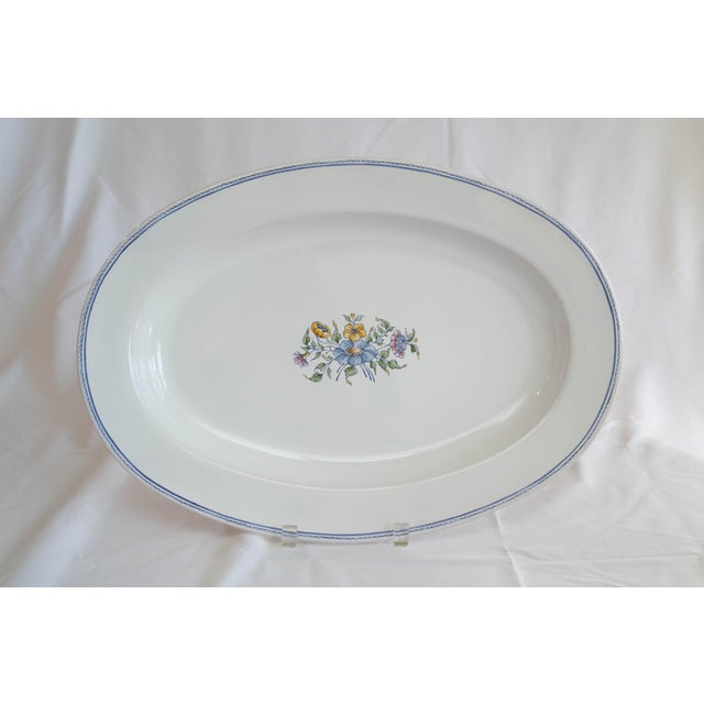 A refined French Moustiers faïence dinnerware set from Atelier de Ségriès, a regional atelier known for its hand-finished...