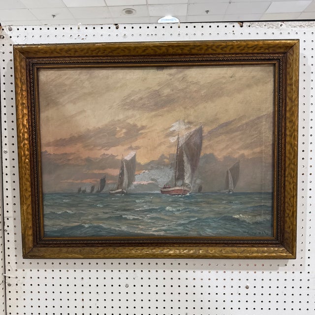 This is a beautiful, atmospheric French School marine painting depicting several sailboats navigating choppy waters at...