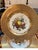 An opulent set of 10 hand painted 9 inch diameter plates, England Circa 1900-1910. These plates with hand painted centers...