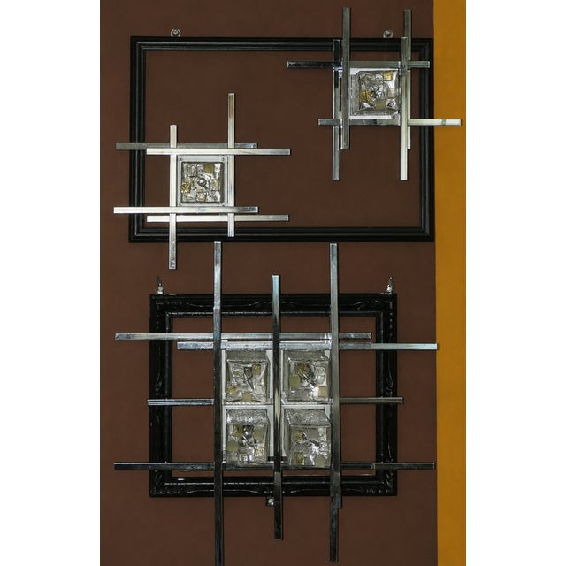 Set of 3 wall lamps by albano poli for poliarte, 1970s. structure with rectangular chromed metal rods and murano glass...