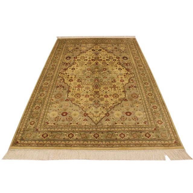 Designed with mesmerizing intricacy and gorgeous color palette, this hand-knotted masterpiece demonstrates the beauty and...