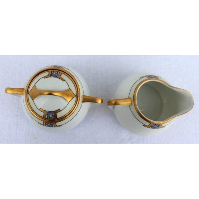The 1925 KPM Art Deco Porcelain Large Creamer and Sugar Dishes are a stunning set featuring gold trim and glossy finish,...
