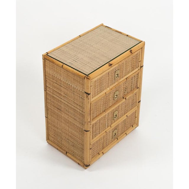 Midcentury amazing chest of four drawers in bamboo, rattan, wicker, top glass and handles in brass attributed to Dal Vera....