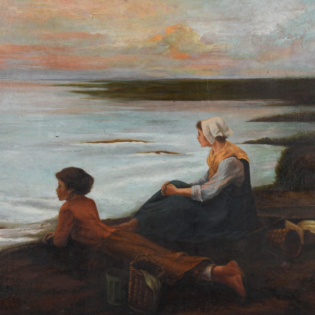 This Framed "Seaside Gazing" Oil on Canvas captures a quiet, contemplative moment between a woman and child seated on a...