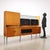 Sideboard with hinged doors, flap doors and exposed drawers, in maple veneer with polyester finish, lacquering with...