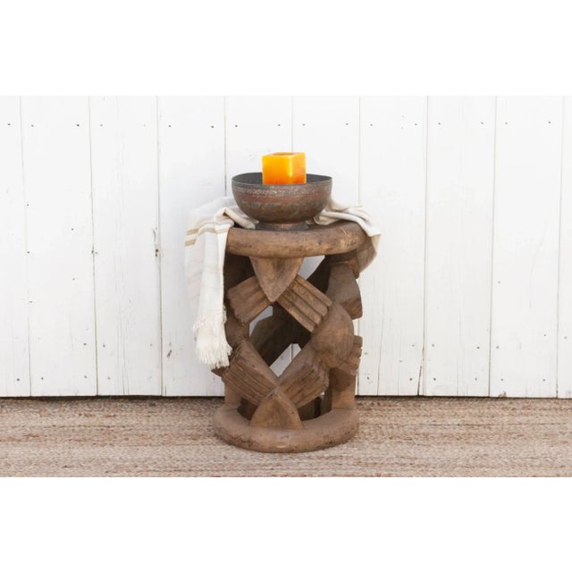 This antique African Bamileke stool, originally use as a throne is hand carved from a single wood log with a waxed finish....