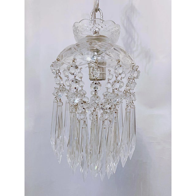 Dome layered chandelier with cut glass dish, octagon chain and 30% leaded U-drop crystals and octagon chain. It rewired...