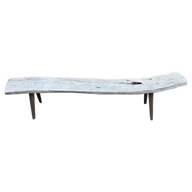 Wabi Sabi teak bench with pale wood tones. We added minimalist cone style legs to this beautiful thick aged panel. The...