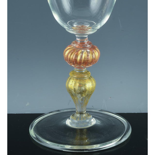 Vintage Murano Glass Champagne Coupes, Peach and Gold-Leaf Ribbed Stems, Set of Ten Mid-to-Late 20th Century This set of...