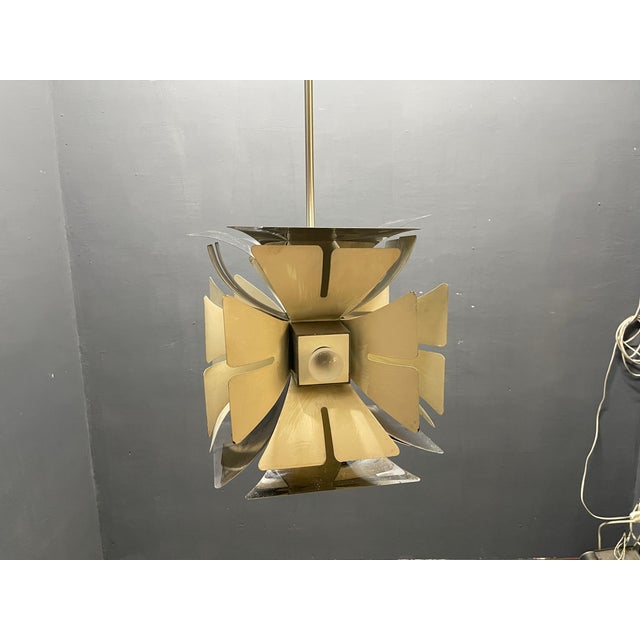 This 1970s space age chrome chandelier is a textbook example of retro-futuristic mid-century design. Featuring a distinct...