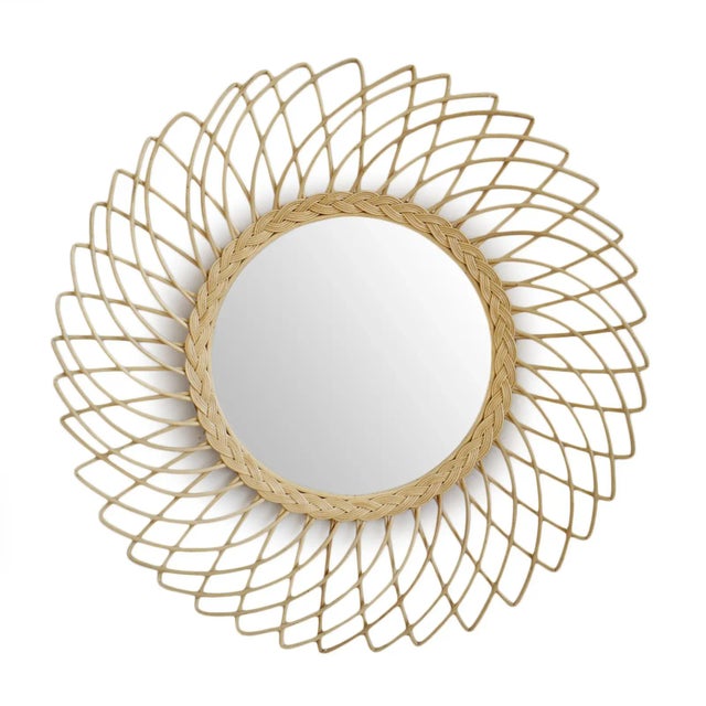 Charming hand crafted rattan mirror. Beautiful sun design frame with braiding around circular mirror in middle. Wonderful...