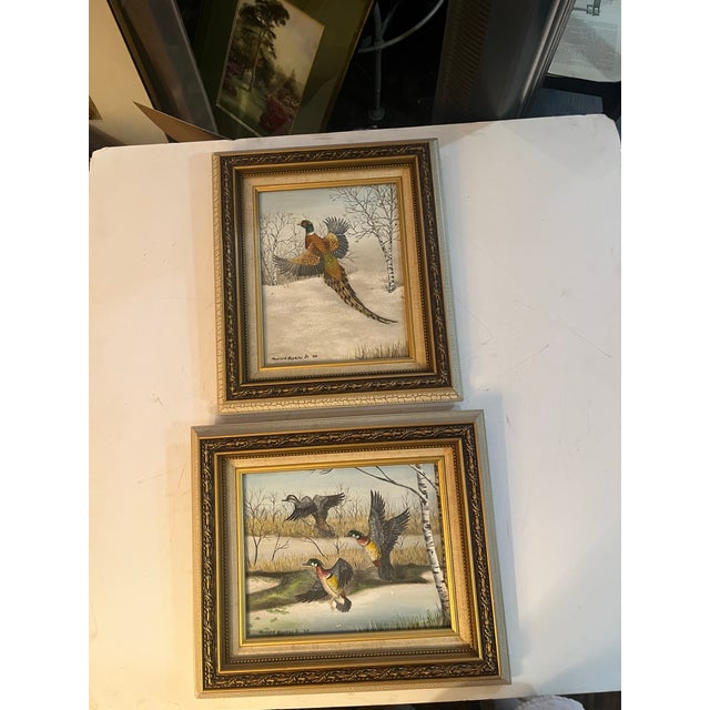 Two very nice acrylic on board birds in Winter scenery by Howard Hopkins Jr. signed and dated 2003. Same frame measuring...