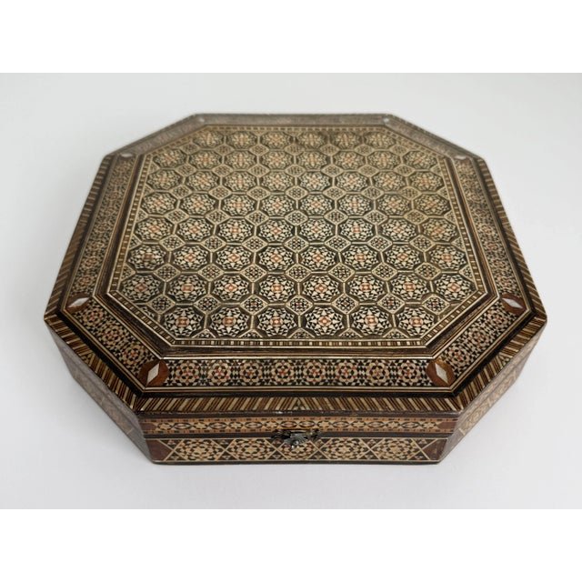 Early 20th-century handmade micro mosaic box crafted of very fine inlay arranged in geometric arabesque patterns....