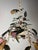 A sculptural and highly decorative Italian tole chandelier, dating to the mid-20th century (circa 1940s–1950s), featuring...