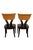 A striking pair of dining chairs by Pietro Costantini, blending a curved klismos-inspired silhouette with a modern...