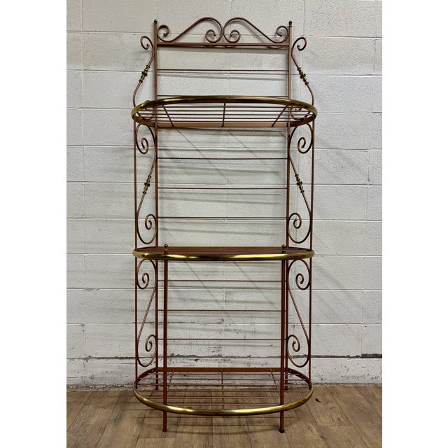This is a stunning vintage iron and brass French style baker’s rack or Boulangerie rack. Features three shelves. Solid and...