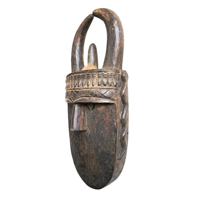 Authentic vintage Toma wood carved tribal mask from Guinea. Beautiful hand carved details and patterns. Horns curving...