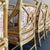 Golden rattan, McGuire target back arm chair. Upholstered in a designer chinoiserie fabric in pink and olive green. Well...