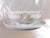 This is a Heinrich & Co. Gravy boat with attached underplate in pattern number HC441 from 1911. It is white with pink...