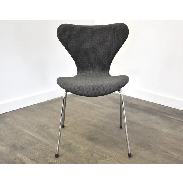 A mid century modern chrome series 7 style desk or dining chair with a grey tweed like fabric. Seat height is 17.25”....