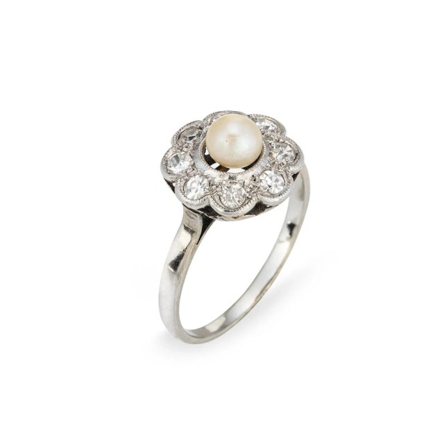 This is part of Chairish’s Fine Jewelry assortment. Stylish antique Edwardian pearl & diamond cluster ring crafted in...