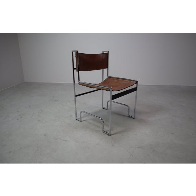 Elevate your interior with this striking set of six vintage dining chairs, showcasing a bold Bauhaus-inspired design....