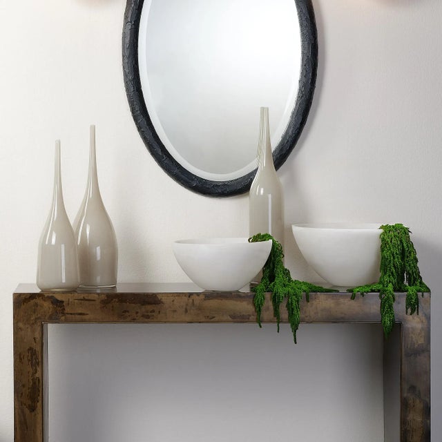 Add a sense of drama to your home with this trio of decorative vases. Made of blown glass, their delicate design and...