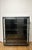 Extremely rare sculptural display case in tempered glass and specially worked steel. Shelf supports, hinges, locks, and...