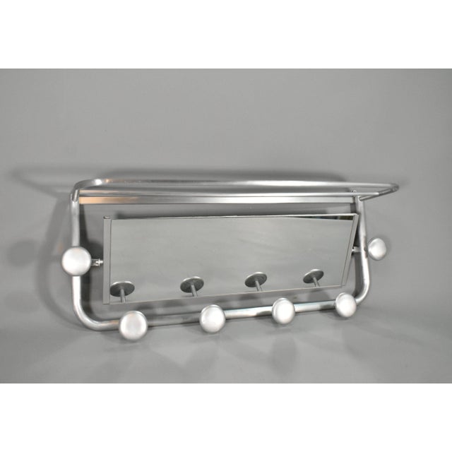 A striking example of French Art Deco design, this aluminium coat and hat rack displays elegant geometric form. with a...