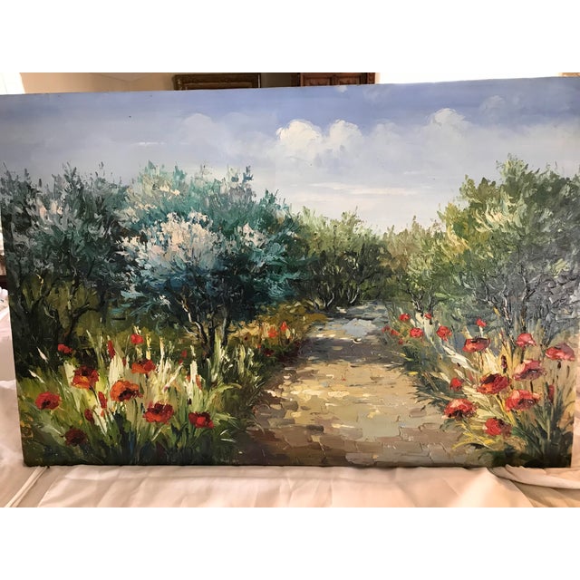 A vibrant oil painting of flowers around a garden walk. Much of the painting was done with a pallet knife and presents as...