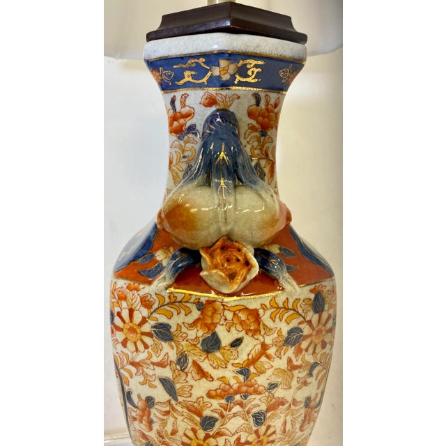 Blue Tall Hexagonal Imari Vase Table Lamp Adorned With Blue, Gold and Orange Floral Patterns - Stands on Wooden Base With White Lamp Shade For Sale - Image 8 of 12