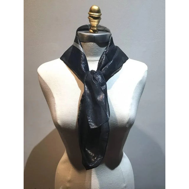 Hermes navy blue silk and lurex woven scarf in excellent condition. Sheer navy blue silk woven with shimmery silver lurex...