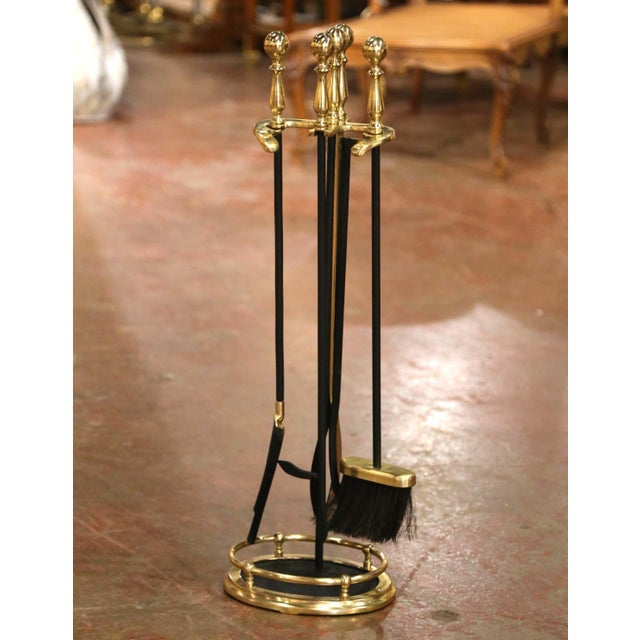 Weighing at an impressive 15 pounds, this elegant vintage fireplace tool set, traditionally known in France as a serviteur...
