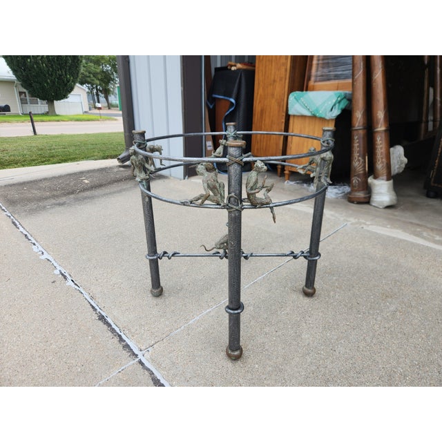 Fantastic vintage Maitland-Smith iron and bronze dining table with a beautiful 54" beveled glass top....the table base...
