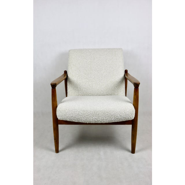 GFM-64 armchair, designed by Edmund Homa from the 1960s, upholstered in white boucle. The GFM-64 armchair, designed by...