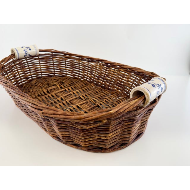 Farmhouse Vintage Woven Wicker Basket With Blue & White Porcelain Handles For Sale - Image 3 of 11
