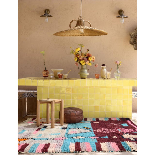 Boujad Rug | Handwoven Berber Wool Rug with Burgundy Field and Figural Totem Motifs This striking Boujad rug features a...