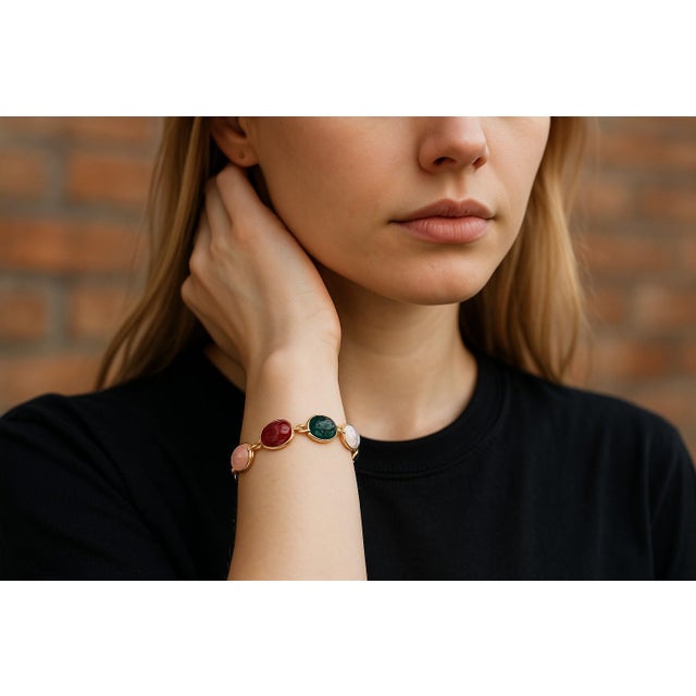 Celebrate timeless symbolism and bold color with this vintage 14K yellow gold scarab bracelet, a striking piece that...