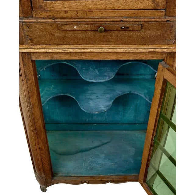 mid 19th century glazed carved oak liege cabinet circa 1860. beautiful 2 piece liege cabinet from belgium presented in...
