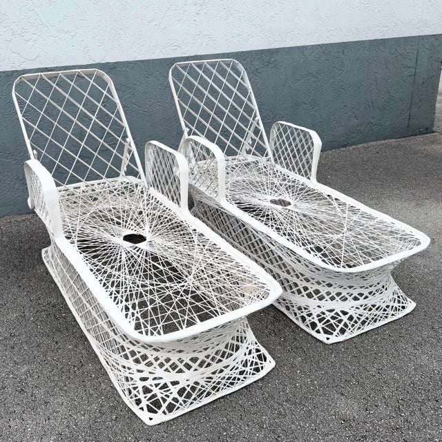 Back rest height not including gap at bottom: 25.5 This pair of mid century modern chaise lounges showcases the airy...