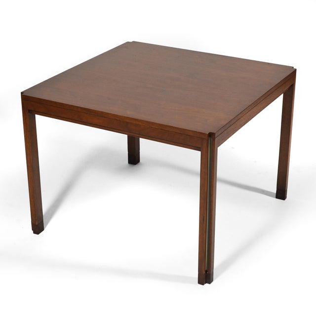 In classic Wormley fashion, this walnut side table has very refined, subtle details. In this case the cut-away corners...