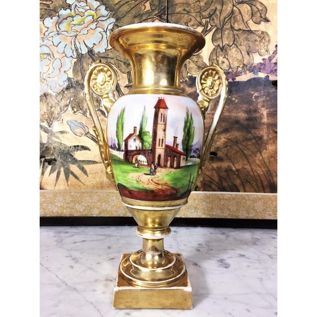 Elegant baluster Paris porcelain vase painted and gilded by hand. The two sides represent a different decoration, on one...