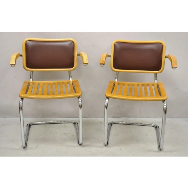 Marcel Breuer Cesca Chair Cantilever Chrome Frame Wood Seat - a Pair. Item features a chrome frame, brown vinyl...