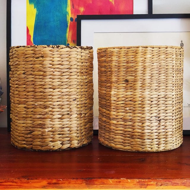 Pair of wall sconces in woven seagrass on a steel frame, made in France in the 1960s. They are not wired and can therefore...