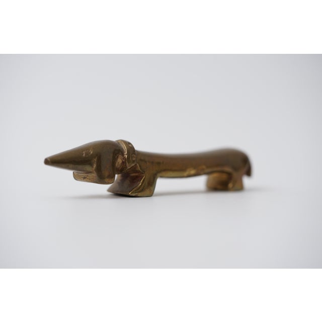Object: Bottle opener in the shape of a dachshund Designer: Walter Bosse (1904–1979) Age: 1950s/1960s Material: Brass...