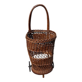 Early 20th Century Handwoven Wicker Rolling Market Basket With Iron Wheels For Sale